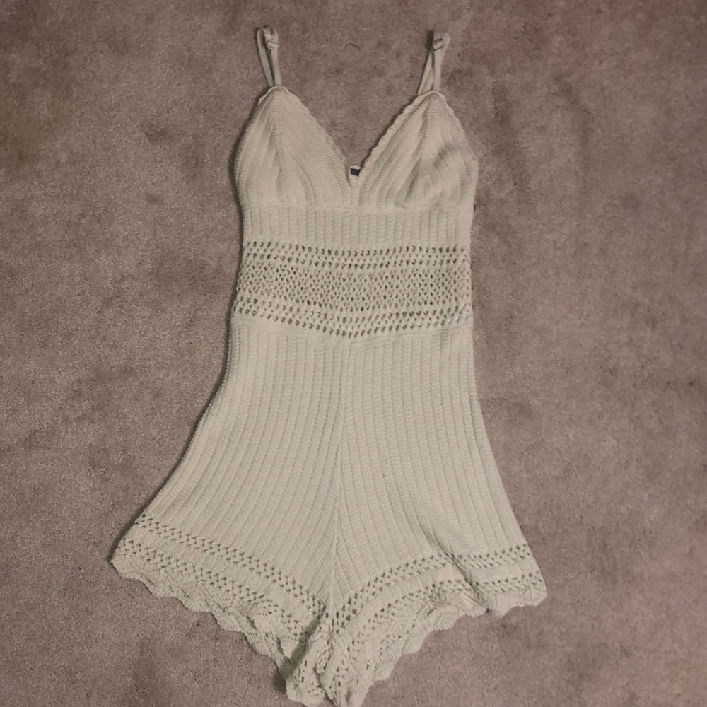 Medium Kendall and Kylie cream romper. Knitted with open designs.